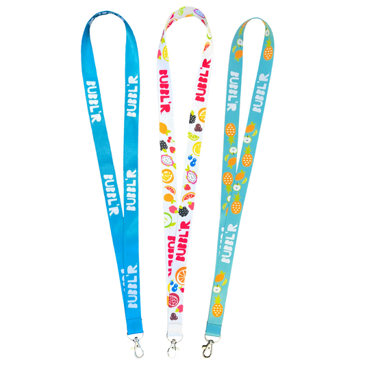 three bubbl'r lanyards. solid blue, fruit patterned and tropical dream'r designs
